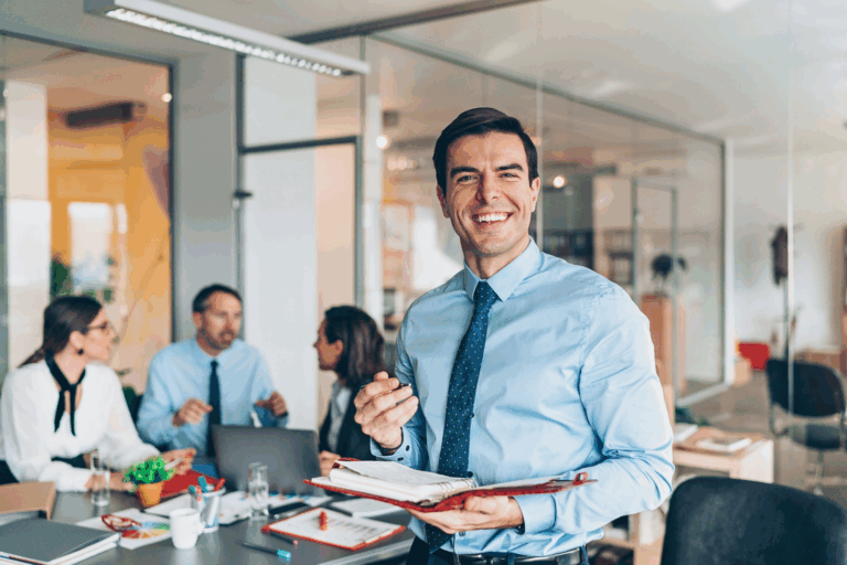 IT leader standing confidently in front of a team of technicians, representing the strength of co-managed services
