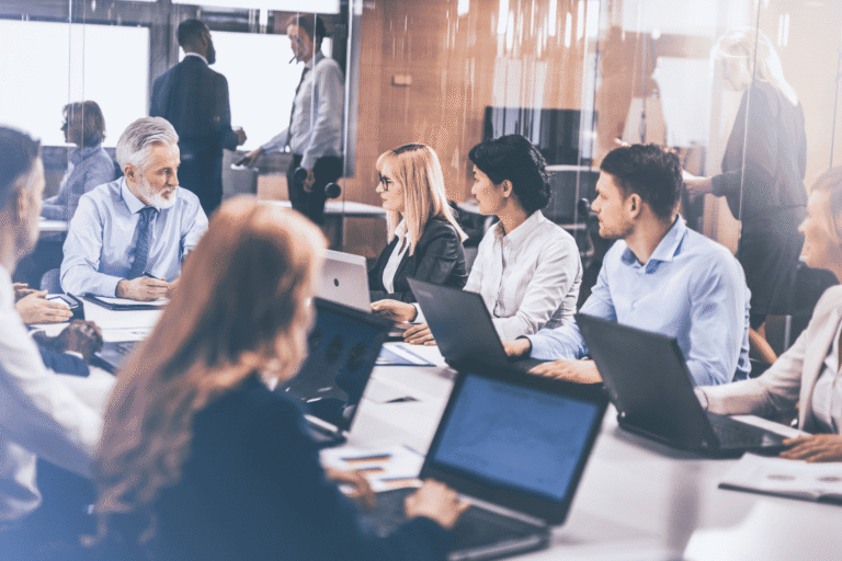 Business leadership team meeting with IT support company to discuss technology strategy and cybersecurity planning.