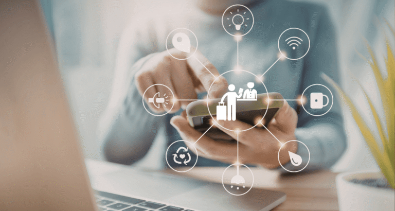 Connected IoT devices forming a circle around a hotel icon, representing smart systems and strategic hospitality