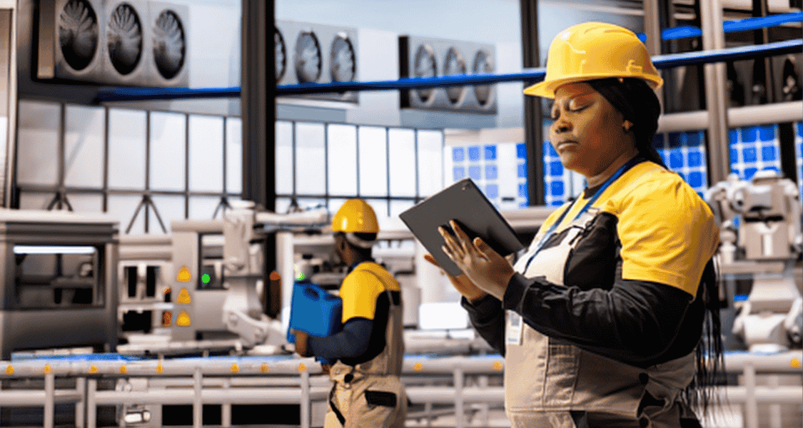 Manufacturing employee using a tablet for secure access to production systems, showing how remote access matters in manufacturing.